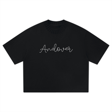 Load image into Gallery viewer, A black short-sleeve crewneck t-shirt with the word 'Andover' written in white cursive script across the chest, displayed on a solid white background.