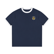 Load image into Gallery viewer, A navy blue ringer t-shirt with white contrast trim on the crew neck and sleeve cuffs, featuring a small gold and white shield logo with the letters 'A' and 'L' on the left chest, displayed on a clean white background.