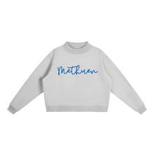 Load image into Gallery viewer, A light gray crewneck sweatshirt with the word 'Methuen' written across the chest in blue cursive script, displayed on a clean white background.
