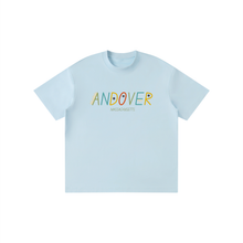 Load image into Gallery viewer, A light blue short-sleeve crewneck t-shirt with 'ANDOVER' and 'MASSACHUSETTS' printed across the chest in a multicolor retro font, displayed on a solid white background.

